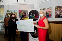 David I Muir and Calibe Thompson of Island SPACE receive a $20,000 check from Juliet Roulhac of Florida Power & Light Company (FPL). Lloyd Stabury of Island SPACE stands in the background. | Photo: RJ Deed