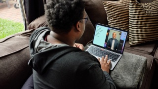 Using FaceTime, Rhys Richard chats with his music professor, Dr. Samuel Rowley, as part of his coursework at Huston-Tillotson University.