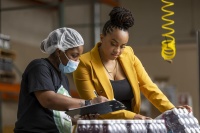 Ellis Isle founder Nailah Ellis-Brown and a team member at work in the Ellis Isle production facility in Detroit, MI.