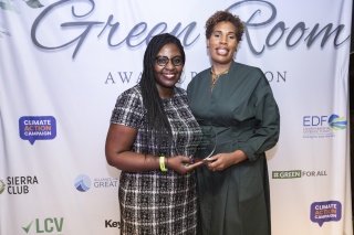 Dana Johnson (left) with the Green Room Award presented by Margot Brown (right)