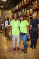 Florida Power & Light Company (FPL) NextSteps Rotation Program Senior IT Scrum Master Latoshia Akins (right) and her son(left) volunteered at the 31st Annual 100 Black Men Thanksgiving Food Drive. Photo Credit: Ricardo Reyes, Sonshine Communications.