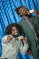 WWE Superstars Austin Watson aka Xavier Woods and Kofi Sarkodie-Mensah aka Kofi Kingston show off their Boys & Girls Clubs of America lifetime membership cards. (Photo: Business Wire)