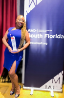 Founder and CEO Lasana Smith receives the "Digital Marketing Campaign of the Year" award from the American Marketing Association