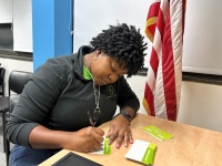 On Feb. 7, 2024, Florida Power & Light Company (FPL) volunteer Darlyne Jean Charles, community relations specialist, packed 1,200 hygiene kits to be distributed to Broward Partnership, the largest comprehensive homeless services provider in Broward County