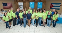 FPL volunteers help distribute hurricane preparedness meal kits for seniors at Allapattah Community Action Center.