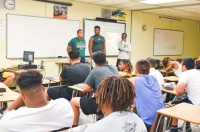 Miami Sunset Senior High School students talk in the classroom during a recent Student ACES workshop.