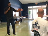 Charles Johnson, who attended the University of Miami and is a former Miami Marlins catcher, speaks to a group of about 55 coaches Aug. 8, 2019 at Christopher Columbus High School.
