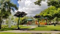 Two FPL SolarNow solar trees provide shade and seating at Charles Hadley Park